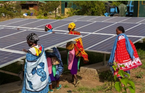 People working with solar panels